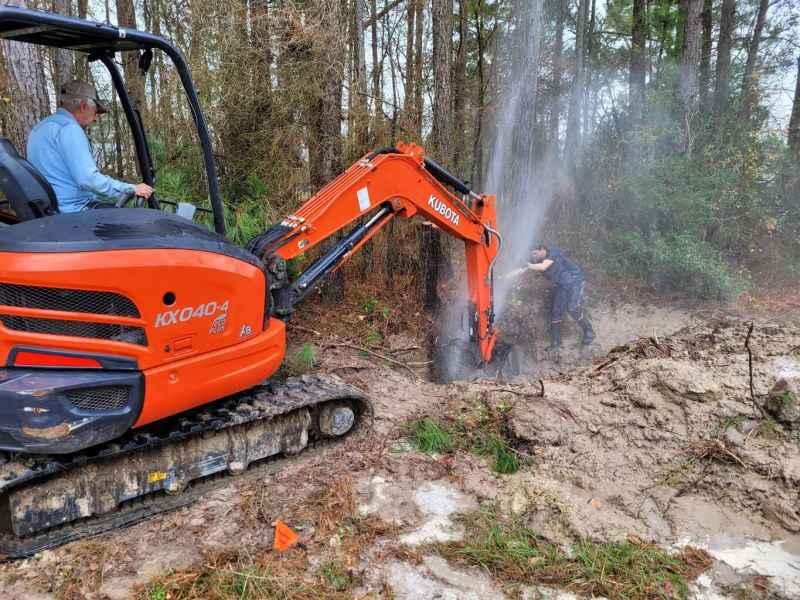 Digging with a tractor near a hole