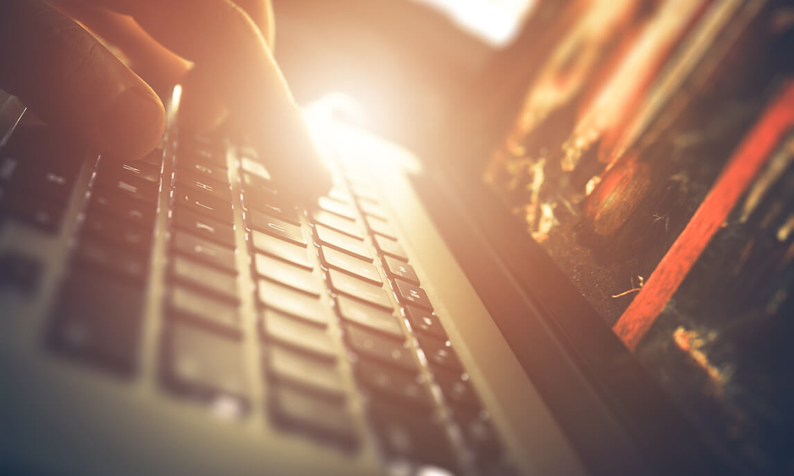 Laptop being browsed closeup of hand on computer